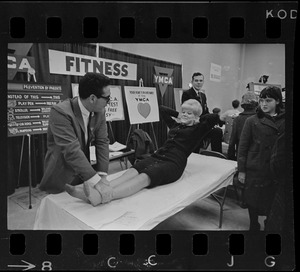 Exercises demonstrated by Nick Tranquillo and Marjorie Santoro at YMCA booth at War Memorial Auditorium