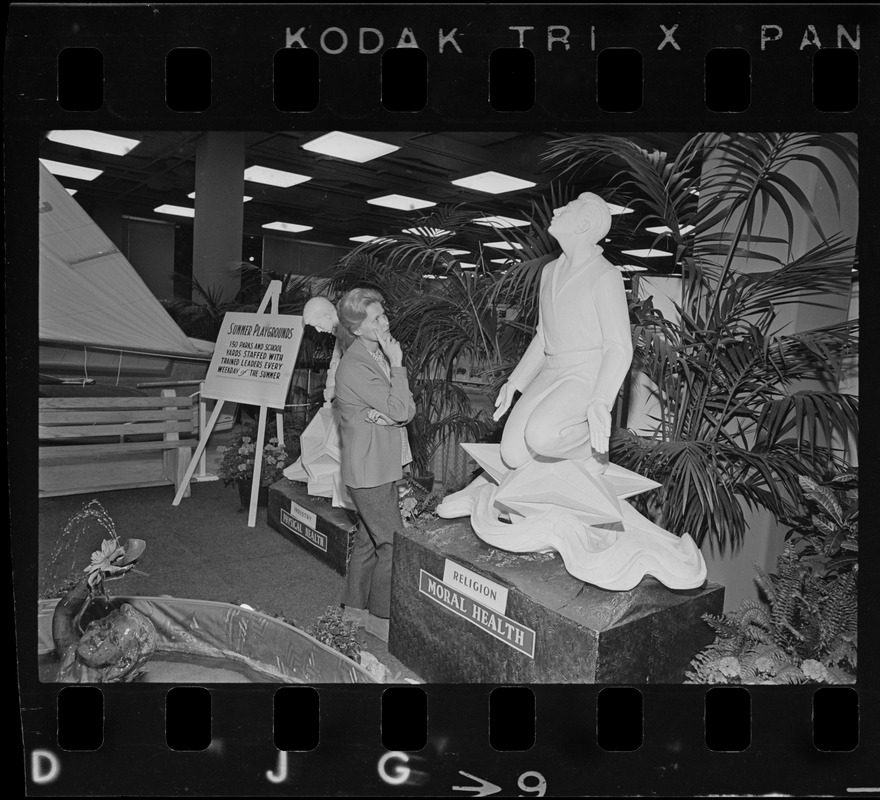 Olga Firth of Dover admires statue in the Park & Recreation exhibit at War Memorial Auditorium