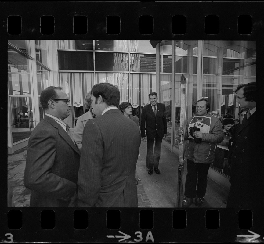 Ruedi Wyrsch after rappelling down the side of the Sheraton Boston wearing skis