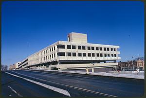 Part of series on Mass. Transit - new Quincy Rapid Transit line to Boston showing parking garage