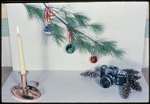 Candle, Christmas ornaments, and camera