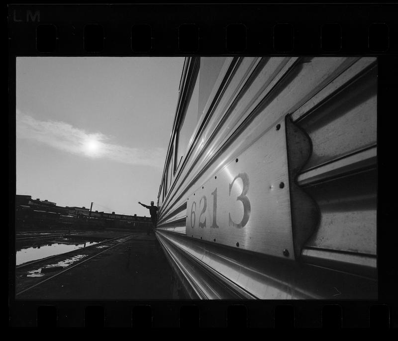 Conductor waves as train leaves North Station, Boston