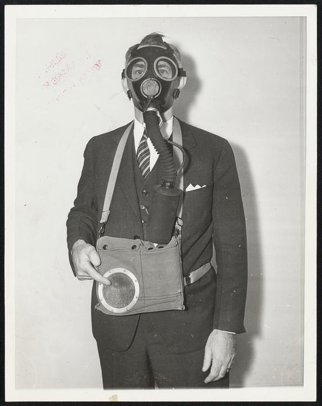 T. A. O’Leary of Pittsburgh shown in the gas mask, with talking equipment attached, which he