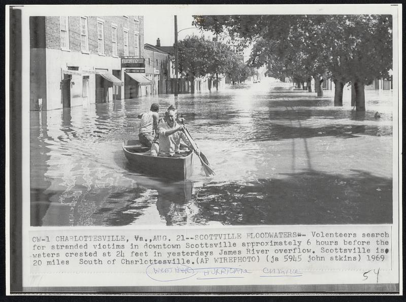 Charlottesville, Va. -- Scottsville Floodwaters -- Volunteers search for stranded victims in downtown Scottsville approximately 6 hours before the waters crested at 24 feet in yesterdays James River overflow. Scottsville is 20 miles South of Charlottesville.