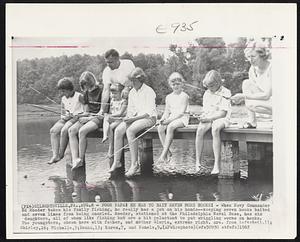 Poor Papa. He Has To Bait Seven More Hooks! – When Navy Commander Ed Roeder takes his family fishing, he really has a job on his hands – keeping seven hooks baited and seven lines from being snarled. Roeder, stationed at the Philadelphia Naval Base, has six daughters, all of whom like fishing but are a bit reluctant to put wriggling worms on hooks. The youngsters, shown here with father, and mother Gloria, extreme right, are from left: Gail, 11; Shirley, 16; Michelle, 5; Donna, 13; Karen, 7, and Pamela, 9.