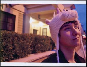Young person in knit unicorn hat