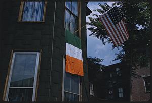 American and Irish flags outside window, Boston