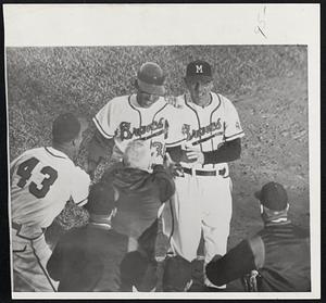 Milwaukee Braves centerfielder Bill Bruton and coach John Fitzpatrick celebrate Bruton's game-winning hit in game 1 of the 1958 World Series