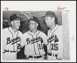 Welcome to our City--Three ex-American Leaguers signed by the Milwaukee Braves mainly as pinch-hitters huddle prior to today's game at Country Stadium. They are, left to right, newly-arrived Enos Slaughter, obtained yesterday from the New York Yankees; Ray Boone, who joined from Kansas City several weeks ago, and Mickey Vernon, formerly of Washington.