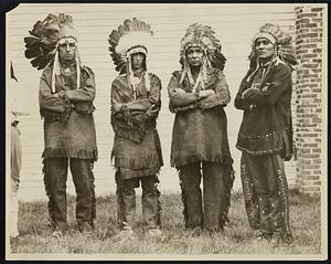 Four full-blooded Indians of the Wampanoag nation who gathered for the three-day powwow of their tribes as Mashpee. Left to right, Chief Standing Rock of the Herring Pond tribe; Chief Red Shell of the Wampanoags; Chief Small Bear of the Mashpee tribe; and Chief High Eagle, medicine man of the Wampanoags.