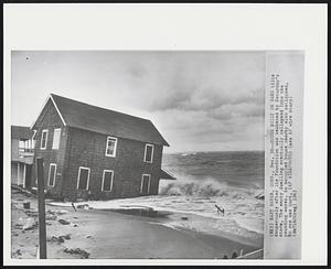 East Haven, Conn. - House Built On Sand tilts dangerously after its foundation was weakened by Saturday's storm. The empty dwelling eventually collapsed into the pounding waves. An occupied house nearby also collapsed. No one was hurt.