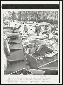 An ordinary trailer park was turned into a mass of mangled steel and wood, after a tornado went through it in ten minutes. These civil defense workers are looking for any survivors.