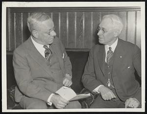 Former mayor Malcolm E. Nichols, president of the Boston Industrial Home, extending felicitations to Treasurer Freeman O. Emerson upon completion of 30 years with the Home.