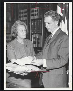 Mrs. Rose M. Benker of Sect'y office with Kevin White looking over received ballot affidavits.