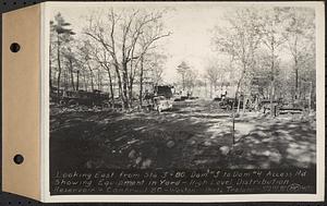 Contract No. 80, High Level Distribution Reservoir, Weston, looking east from Sta. 3+80, dam 3 to dam 4 Access Road, showing equipment in yard, high level distribution reservoir, Weston, Mass., May 29, 1940