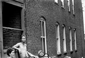 Left to right, Mary Ann Smith, Frank Saunders and Jack Madden observing the fire from an alley