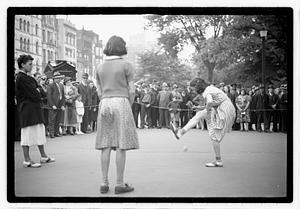 Two young women competing, Boston Common