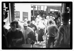Passengers getting on a ship