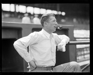 An injured Lefty Grove smoking a pipe