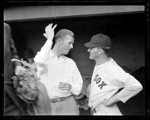 Lefty Grove shows off injured pinky to Fritz Ostermueller