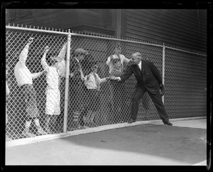 Gov. Frank G. Allen greets kiddies at a ball game