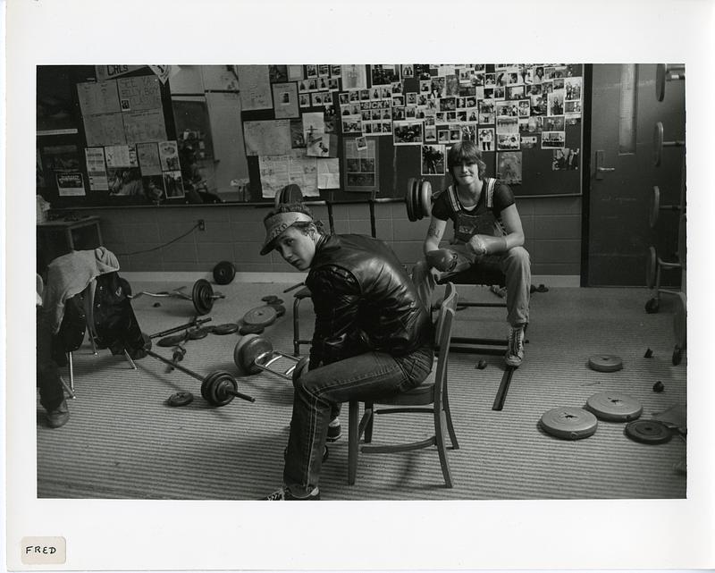 Two teenagers in a makeshift gym