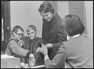 John & Spall taking candy while mother Mrs. Wm. Frances Ackerly getting appointment from Mrs. Diana Blood.