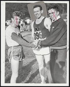 Happy Huskie Ed Shea (center), winner of the 41st running of New England Cross Country championship is congratulated by Boston U.'s Johnny Kelley (left) who finished second and third place finisher John Farquhar of M.I.T. (right). The 21-year-old Northeastern senior hails from Dedham.