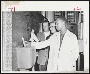 Baseball Was Never Like This--Three members of the world champion Milwaukee Braves, L-R, pitcher Bob Trowbridge, property man Joe Taylor and outfielder Hank Aaron get set to punch a time clock in a local brewery (Miller) today after reporting for work. The trio will serve as sports promotion representatives for the brewery during the off season and travel throughout the country giving talks.