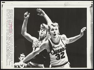 Barging By--Billy Cunningham of the 76ers barges past Dave Cowens of theBoston Celtics as he tries to retrieve the ball he attempted to steal on a pass intended for Cowens in the first quarter of Saturday night's game in Philadelphia. Ball went out of bounds off Cunningham.