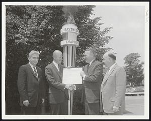 Torch Lightning Presentation - Charles F. Adams, Raytheon president and vice president in the United Fund (second right), receives United Fund membership charter certificate for his firm's employes. Making presentation is O. Kelley Anderson (second right), president of the New Mutual Life Insurance Co., and fund chairman. observing torch - lighting ceremony are Edward J. McDonald, left, and Joseph Connolly, right, union officials.