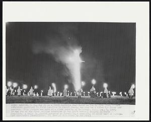 A North Carolina Klan Rally -- The Ku Klux Klan, silent and almost unnoticed in North Carolina in recent years, has started a drive for money and members. This picture was made at a cross burning at Salisbury, N.C., Aug. 8, 1964. It was one of the first rallies scheduled in the KKK’s revival efforts in North Carolina. A rally is planned Saturday at Farmville, a community 55 miles east of Raleigh.