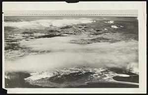 Columbus Was right, All Right. The camera is backing up Christopher Columbus in the matter of the earth's rotundity. Here is a photo taken from a naval plane flown by Lieut. T.R. Frederick at an elevation of 18,000 feet, showing a portion of the pacific coast country near San Diego. Calif., with a marked falling away of the horizon at the sides. The middle of the horizon in the picture is .03 of an inch higher then the ends.