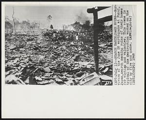 Search Earthquake Ruins--Survivors of the June 28 earthquake at Fukui, Japan, search smoking ruins of their homes for victims and valuables. This scene is typical of the destruction worked on the city by fire and quake.