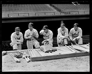 Athletics player poses in dugout with Red Sox players. (Far left Lefty  Grove, Jimmie Foxx 2nd from right) - Digital Commonwealth