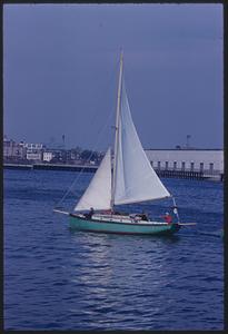 Green sailboat in Boston Harbor