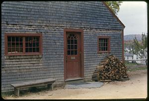 Building with woodpile, Old Sturbridge Village, Sturbridge, Massachusetts