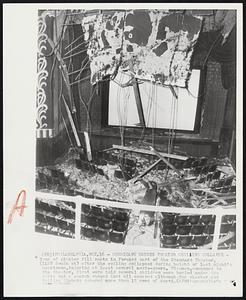 Hurricane Causes Theater Ceiling Collapse - Tons of plaster fill seats in forward part of the Standard Theater, (1128 South st) after the ceiling collapsed during height of last night's hurricane, injuring at least several movie-goers. Firemen, summoned to the theater, first were told several children were buried under the debris but a search showed that all escaped although the plaster and falling timbers covered more than 15 rows of seats.