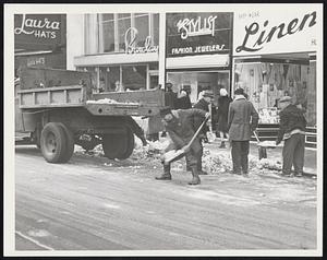 Weather Snow removal. Workmen on street