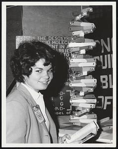 Fair Scientist-Patricia Killion, 16, of Quincy, smiles in front of the model of the DNA molecule she has spent since November making.