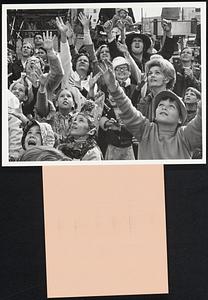 "... the "throws" or trinkets flipped to greedy spectators. (Since the Rex parade started doing it in 1960, it's been the rage to throw cheap aluminum coins called doubloons which have become collectors' items)."