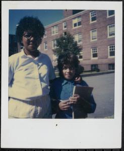 Two young people standing in Newtowne Court