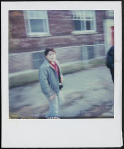 Boy walking outside Newtowne Court