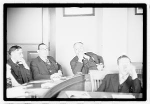Group of men at table