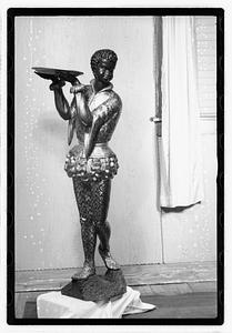 Statue holding a tray