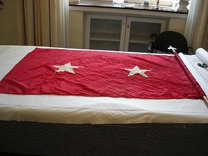 Banner with white stars on a red ground