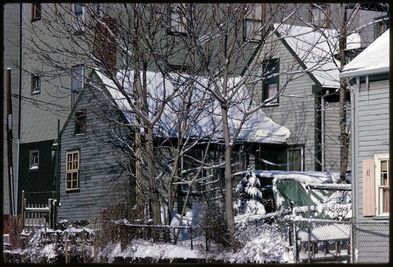 Snow on houses and car