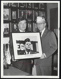 For Permanent Display. Photograph of the late President, John F. Kennedy, is presented by Crosscup-Pishon Post, American Legion, commander Robert Gladwyn, left, to Legion’s Massachusetts Department Commander Thomas Abely, President was member of post. Photo will be displayed permanently in State House Legion office.