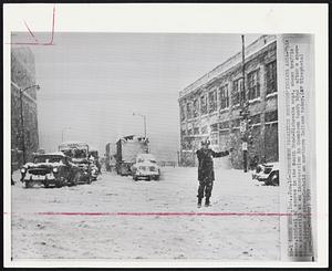 South Bend, Ind. -- Snowstorm Paralyzes Northern Indiana Area -- This scene, typical of scores in the South Bend -- Mishawaka area, shows traffic at a standstill at an intersection in downtown South Bend after a snowstorm placed a strangle-hold on northern Indiana today.