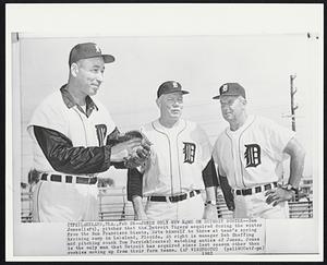 Jones Only New Name on Detroit Roster -- Sam Jones (left), pitcher that the Detroit Tigers acquired during the winter from the San Francisco Giants, sets himself to throw at team's spring training camp in Lakeland, Florida. At right is manager Bob Sheffing and pitching coach Tom Ferrick (center) watching antics of Jones. Jones is the only man that Detroit has acquired since last season other than rookies moving up from their farm teams.